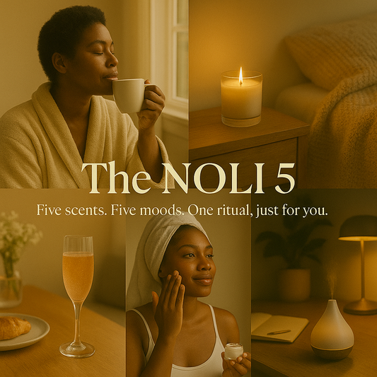 A promotional image featuring two adults in a cozy setting with candles and wine, showcasing jars of body butter with the text 'The NOLI 5, Five scents, Five moods, One ritual, just for you.'.